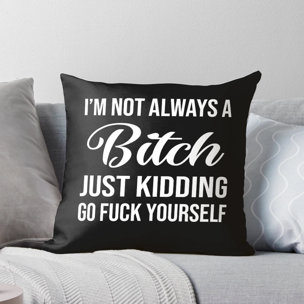 A black and white decorative pillow with the text "I'm not always a bitch, just kidding go fuck yourself" printed on it.