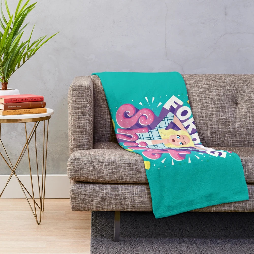 Plush blanket with cheeky typography and sitcom-inspired graphic design