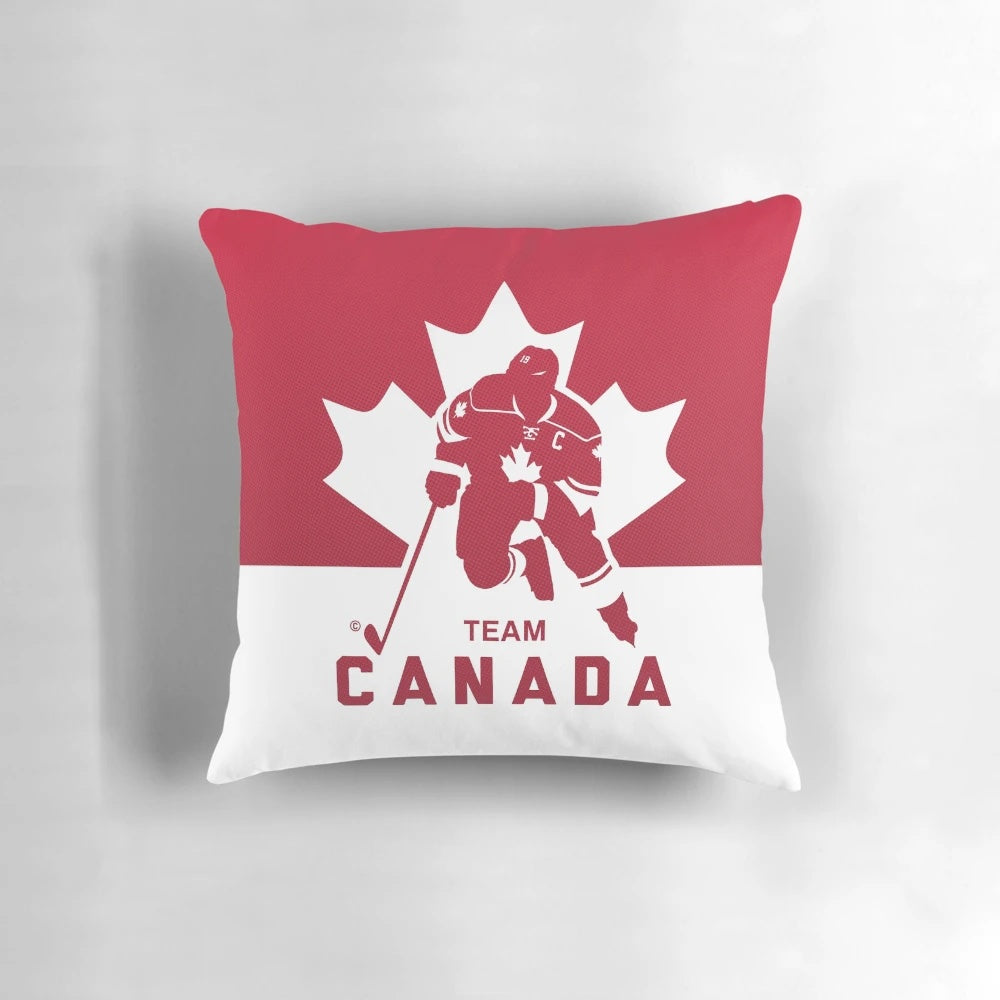 Team Canada hockey-themed decorative pillow featuring a maple leaf and puck design