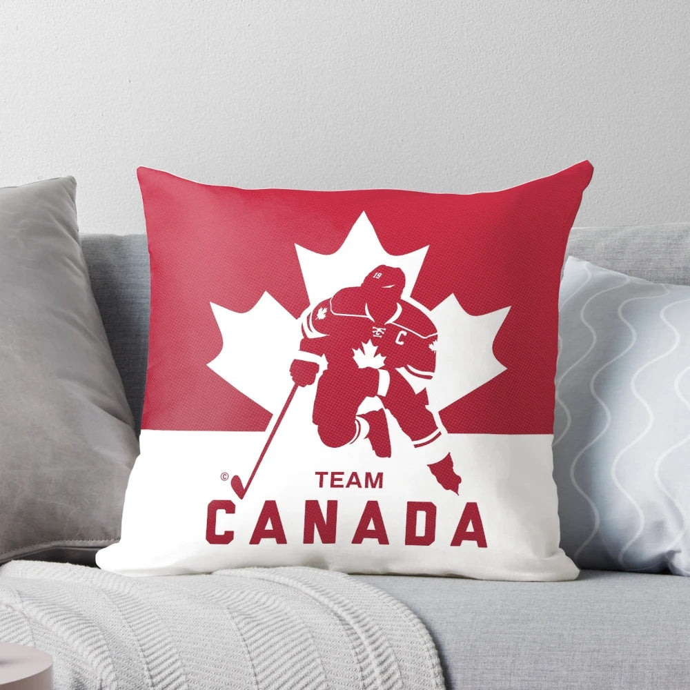Team Canada hockey-themed decorative pillow featuring a maple leaf and puck design