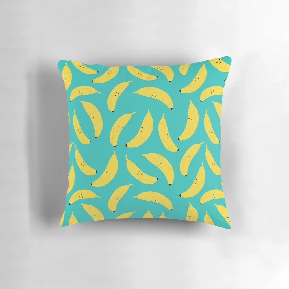 Vibrant yellow banana-patterned pillow with a happy, cartoon-like design