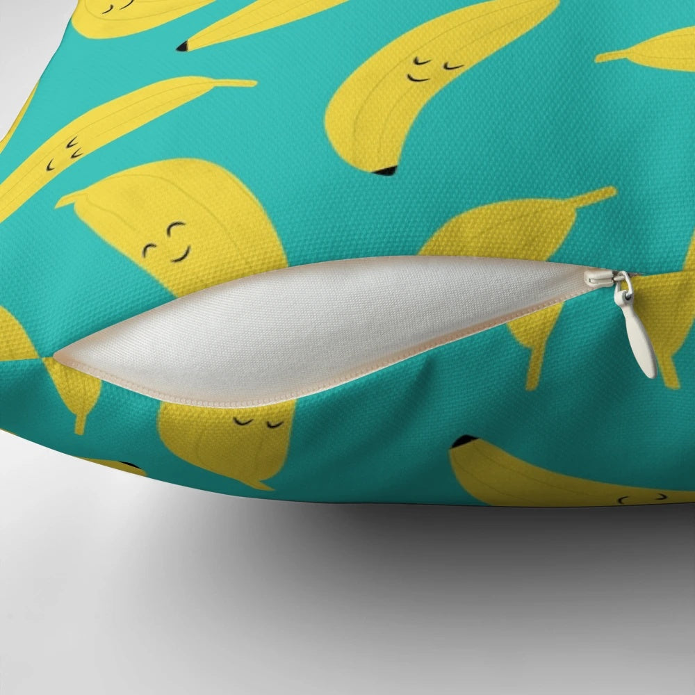 Vibrant yellow banana-patterned pillow with a happy, cartoon-like design