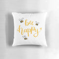 Bright yellow bee-themed pillow with "Bee Happy" lettering