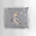 Colorful decorative pillow featuring a happy, singing cockatiel surrounded by musical notes.