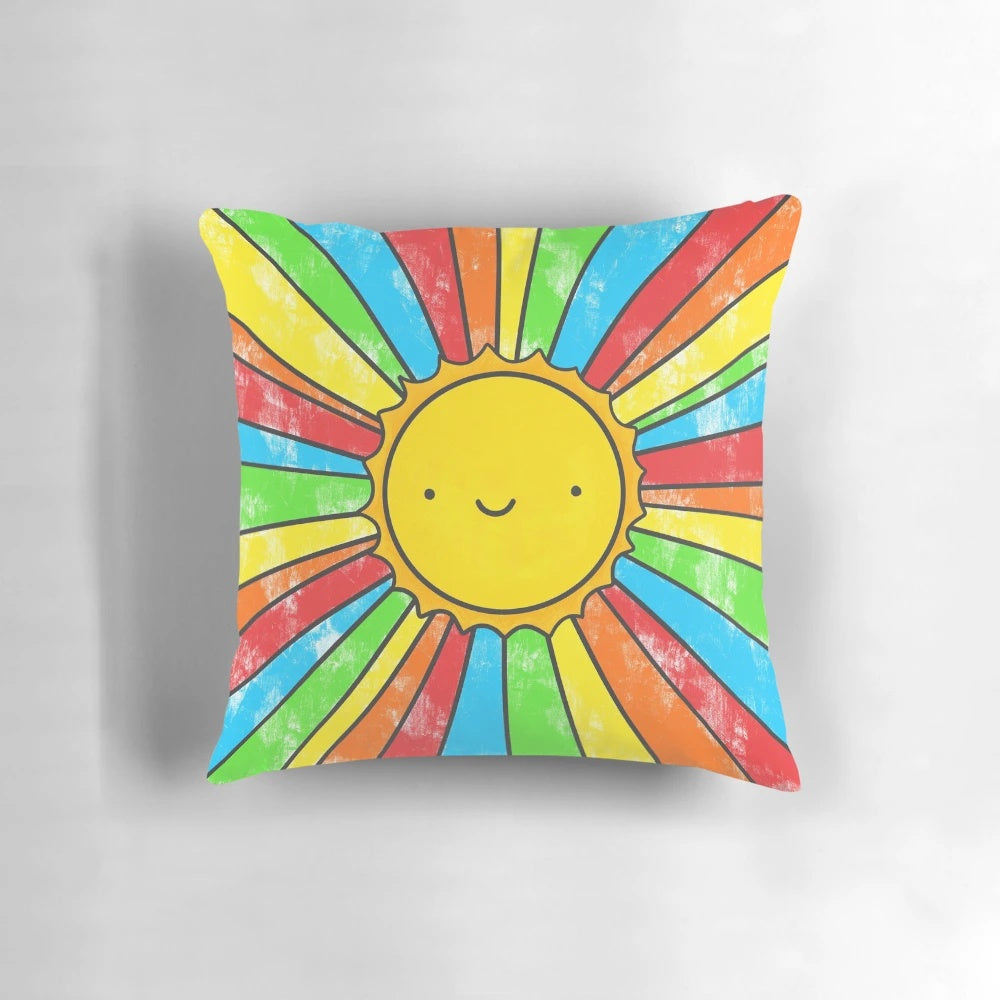 Colorful pillow with sun, rainbow, and positive quote design