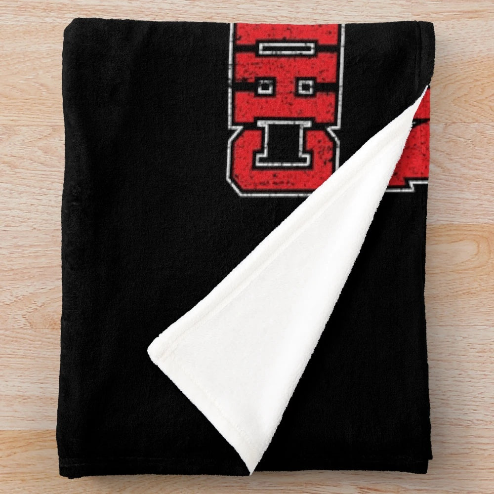 Cheerleading plush blanket featuring the Navarro Bulldogs logo and team colors