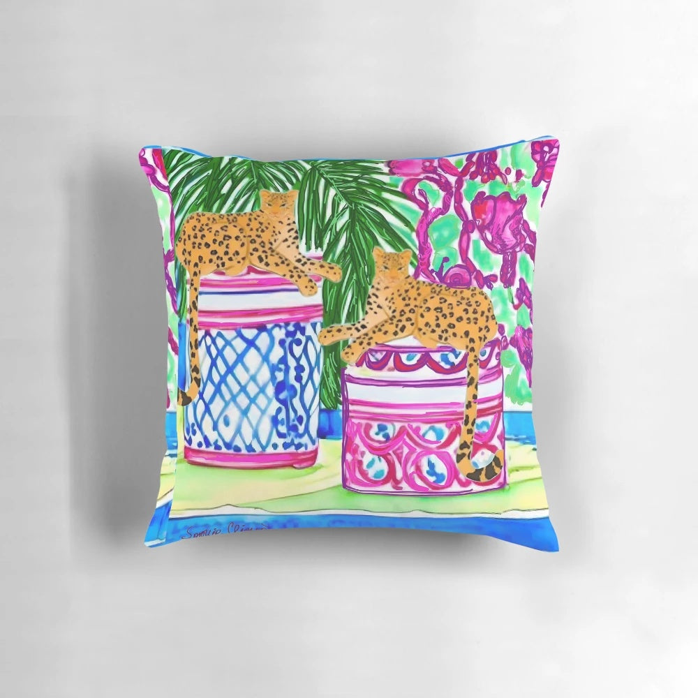 Decorative pillow featuring a watercolor painting of two cheetahs on chinoiserie jars