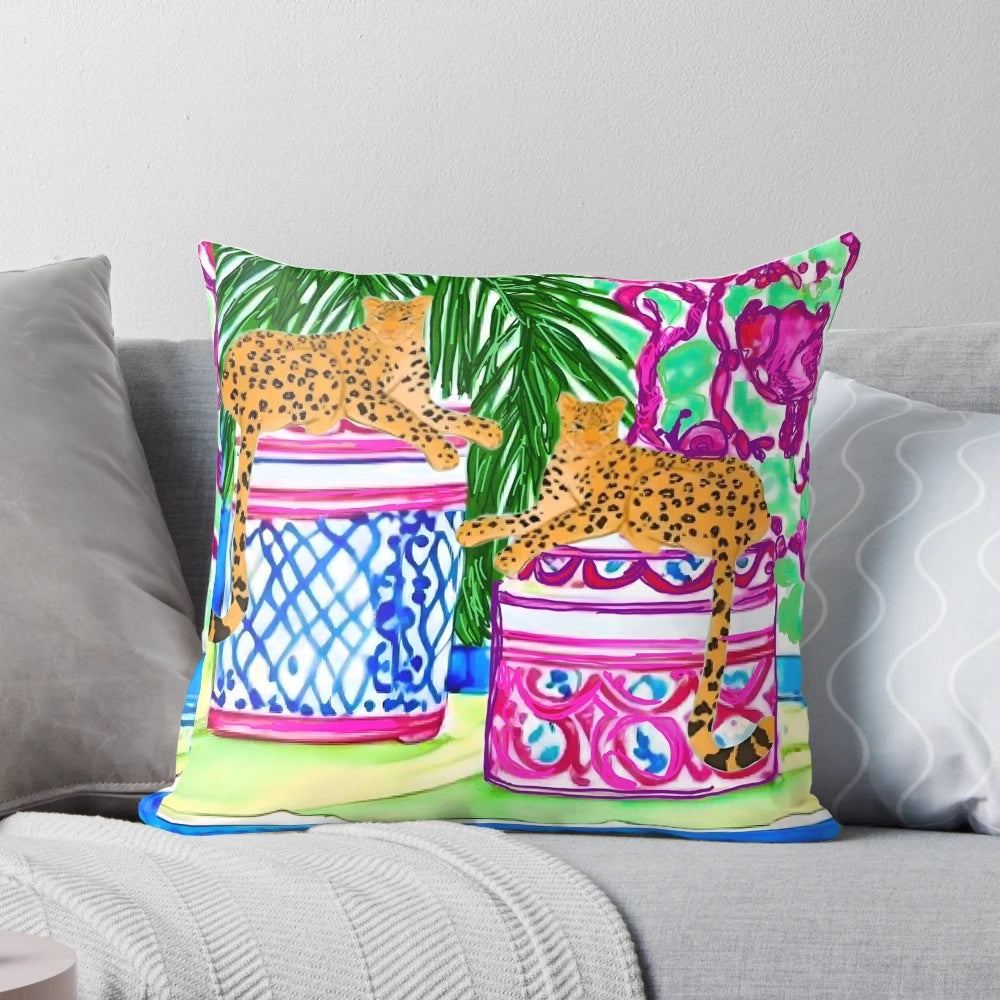 Decorative pillow featuring a watercolor painting of two cheetahs on chinoiserie jars