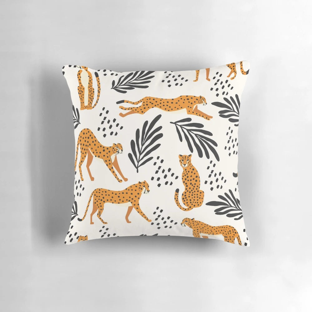 Cheetah print pattern decorative pillow with abstract floral and leaf elements