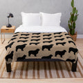 Newfoundland dog (Newfie) on a plush blanket