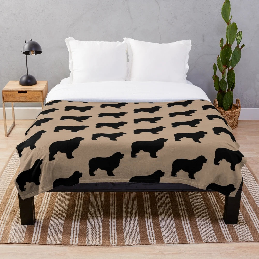 Newfoundland dog (Newfie) on a plush blanket
