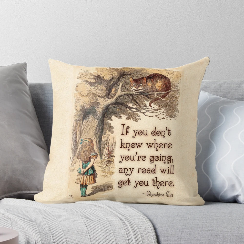 Decorative pillow featuring the quote "We're All Mad Here" from the Cheshire Cat in Alice in Wonderland by Lewis Carroll.