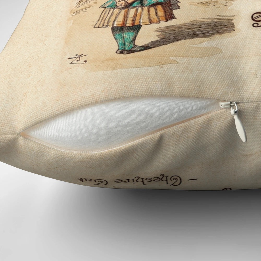 Decorative pillow featuring the quote "We're All Mad Here" from the Cheshire Cat in Alice in Wonderland by Lewis Carroll.