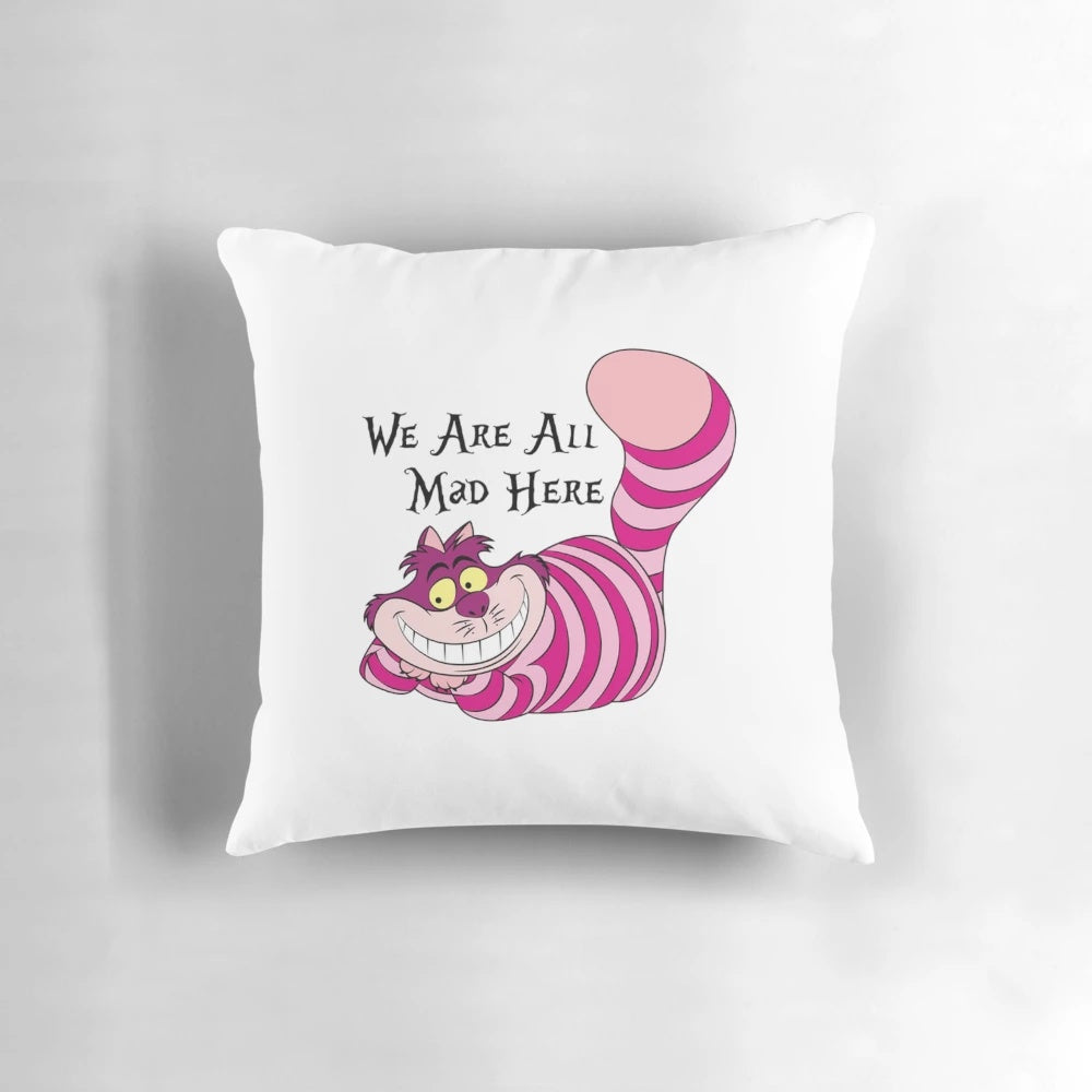 Cheshire Cat decorative throw pillow with a vintage-style illustration and the quote "We're all mad here