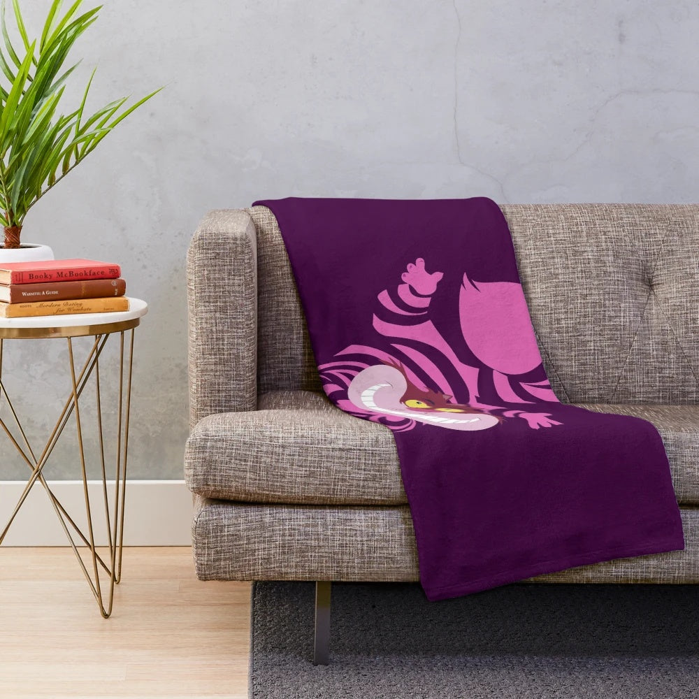 Cheshire the cat plush blanket featuring a whimsical, cartoon-style design