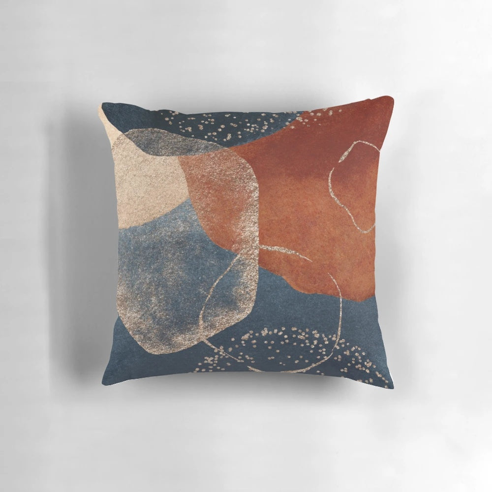 Stylish abstract art decorative pillow in navy blue, blush pink, and terracotta colors