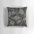 Stylish abstract black and gold throw pillow with a modern geometric mosaic design