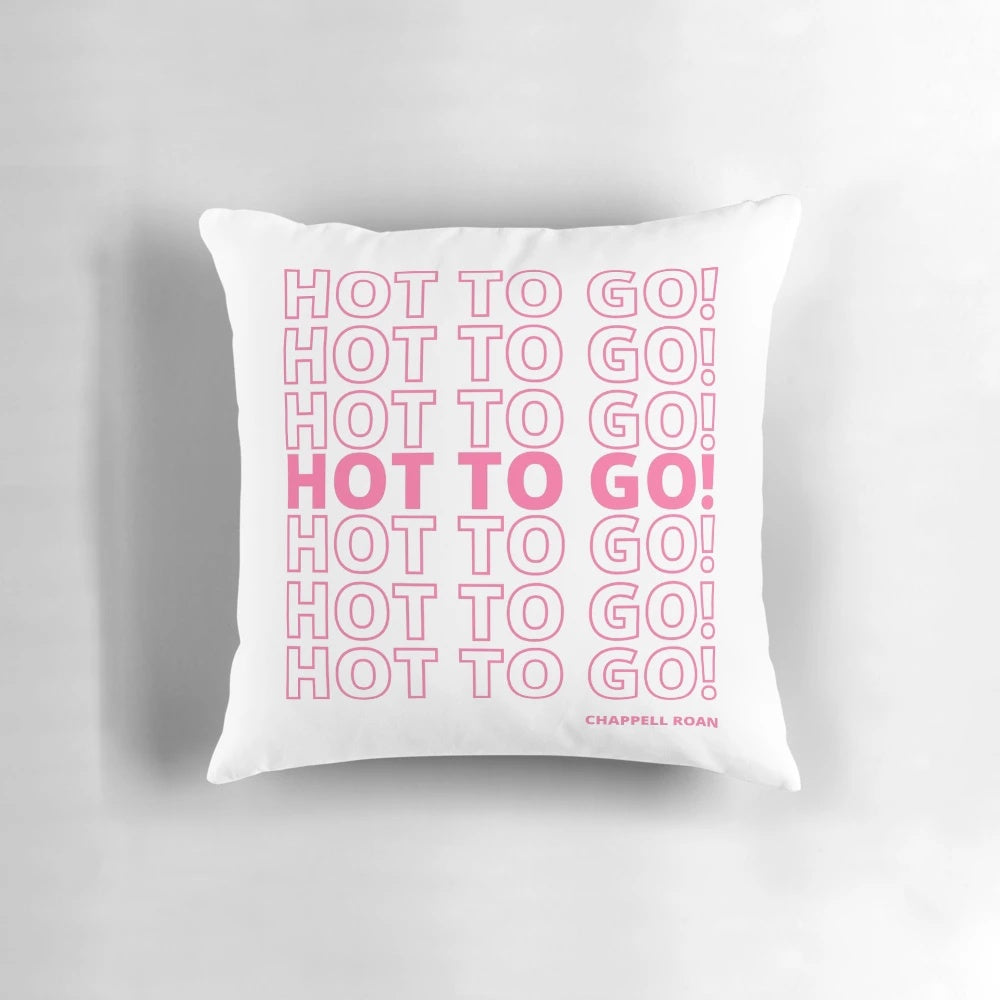 Colorful and playful decorative pillow featuring a vibrant pink design with quirky and fun elements.