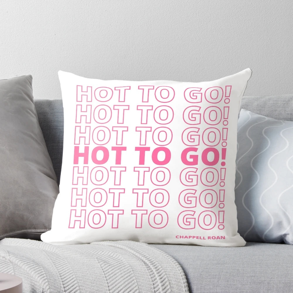 Colorful and playful decorative pillow featuring a vibrant pink design with quirky and fun elements.