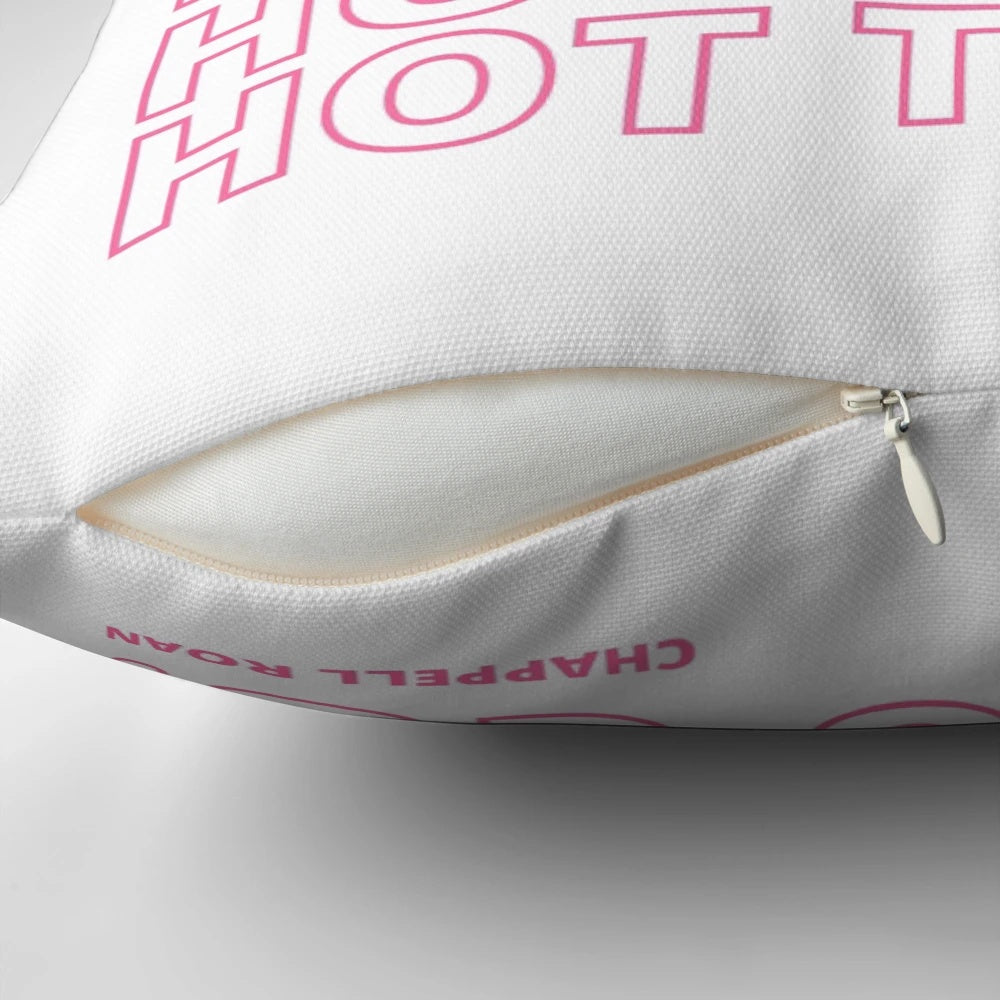 Colorful and playful decorative pillow featuring a vibrant pink design with quirky and fun elements.