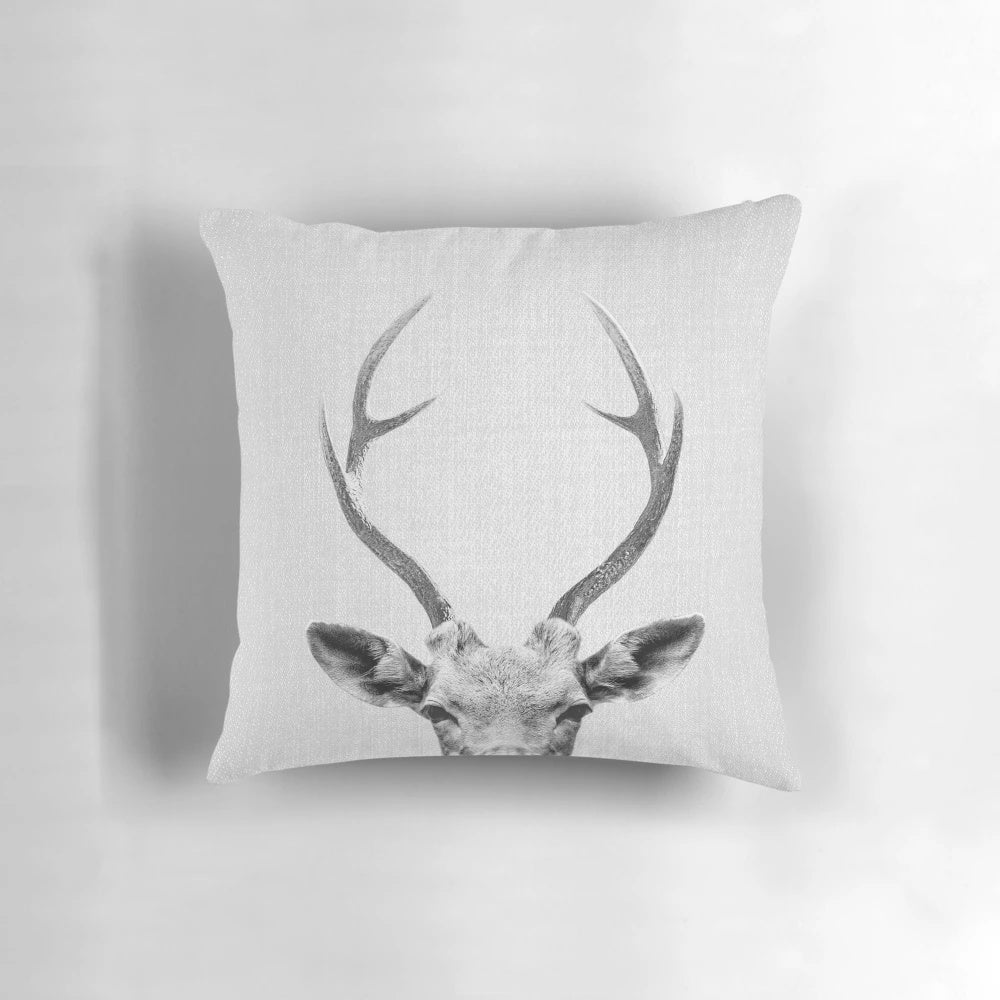 Minimalist black and white deer pillow with antlers and head design