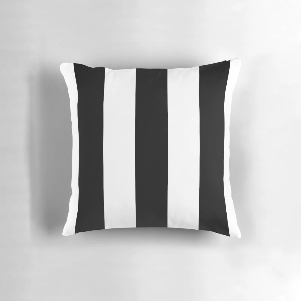 Black and white striped pillow with an awning-inspired design from rewstudio