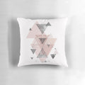 Soft, modern accent pillow featuring an abstract geometric pattern in soothing blush pink and grey tones.