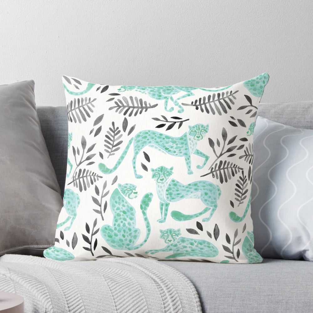 Vibrant cheetah print pillow with a modern black and mint color palette, perfect for adding a touch of safari-inspired style to your home.