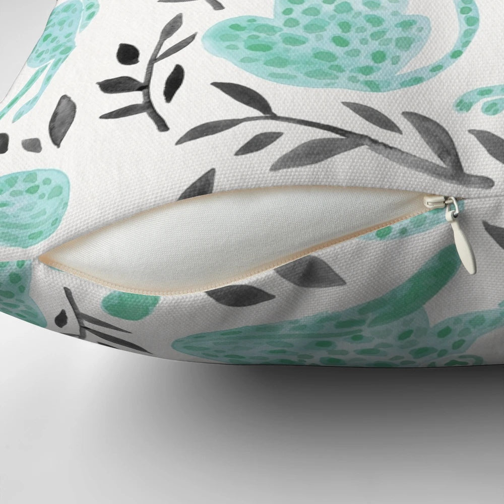 Vibrant cheetah print pillow with a modern black and mint color palette, perfect for adding a touch of safari-inspired style to your home.