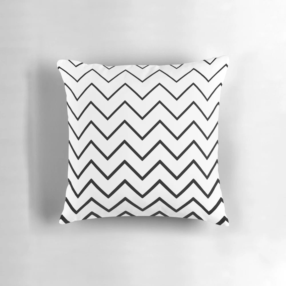 Chevron zigzag patterned pillow in black and white, designed for modern decor