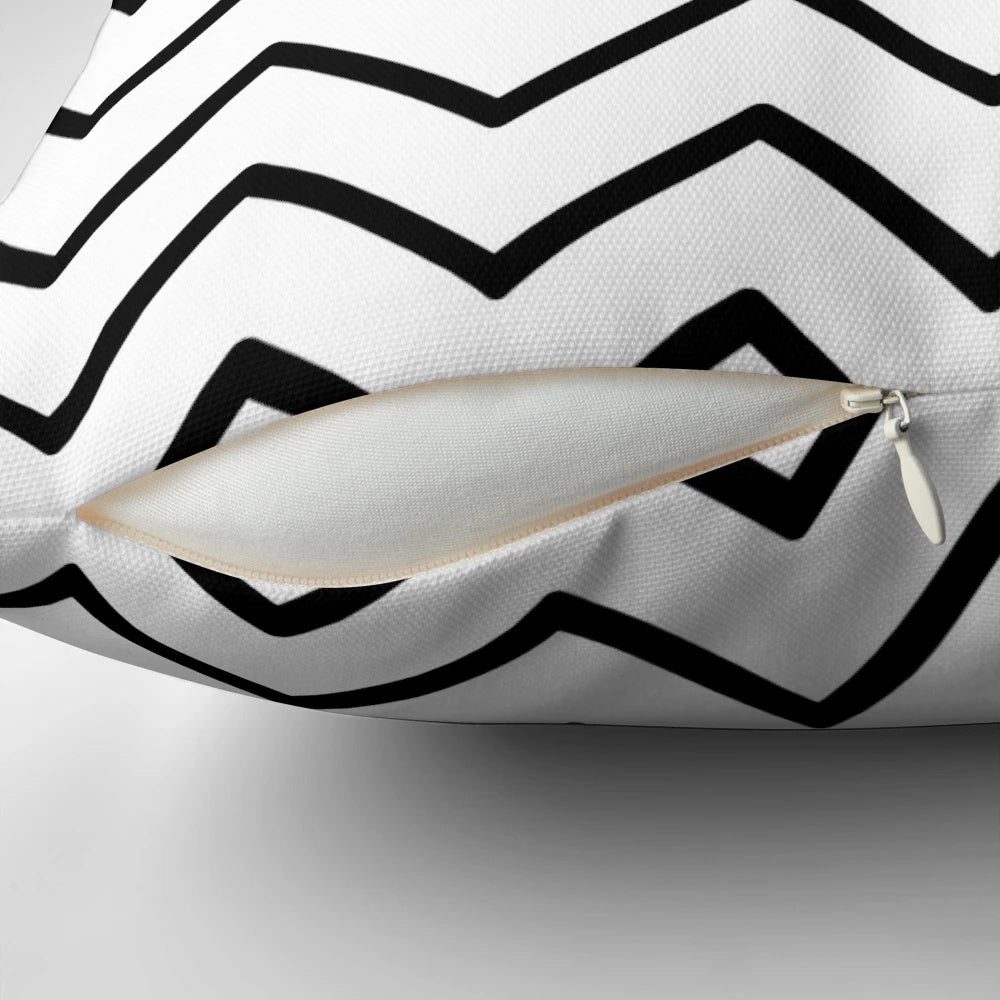 Chevron zigzag patterned pillow in black and white, designed for modern decor