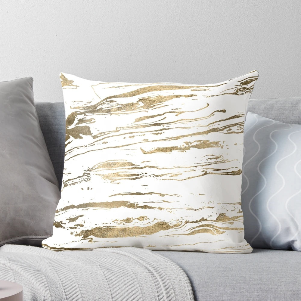 Gold abstract marbleized throw pillow with a modern, elegant design for stylish home accents