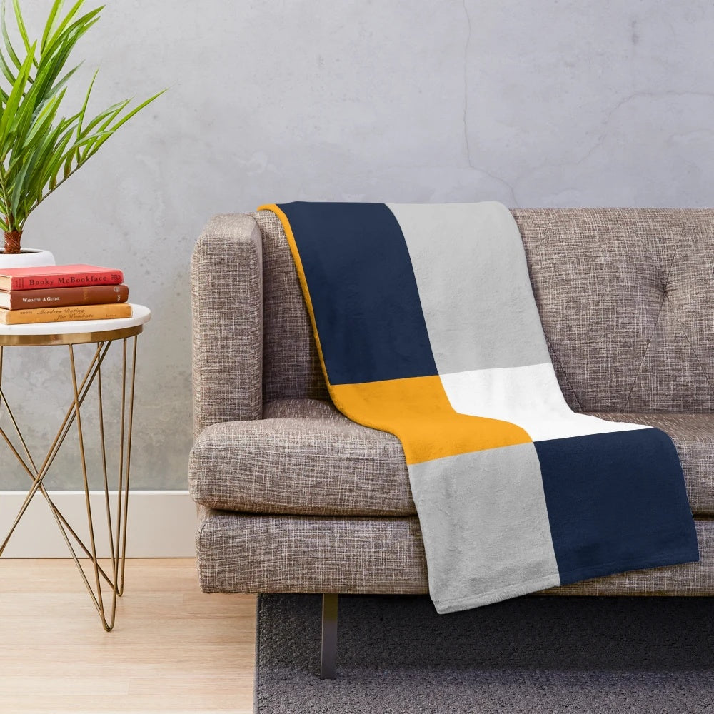Stylish color block plush blanket in navy, grey, and yellow