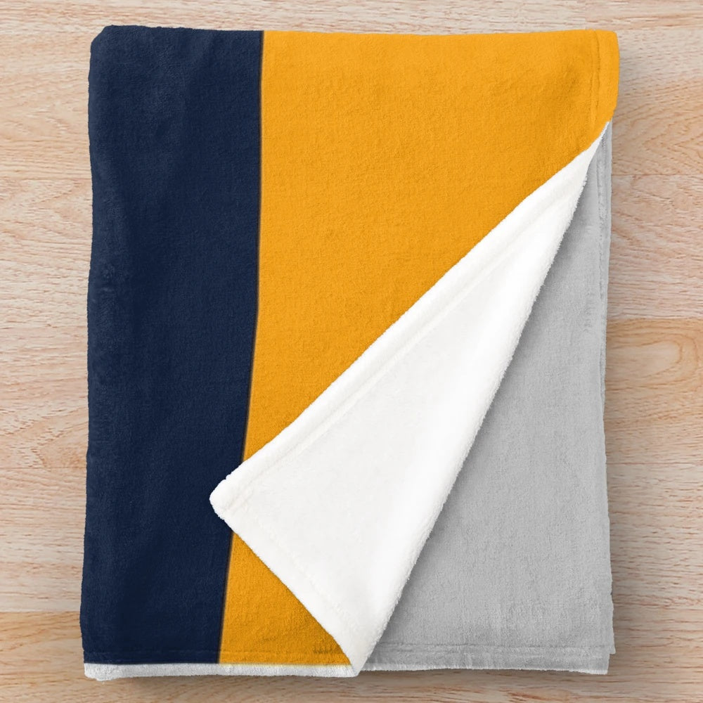 Stylish color block plush blanket in navy, grey, and yellow