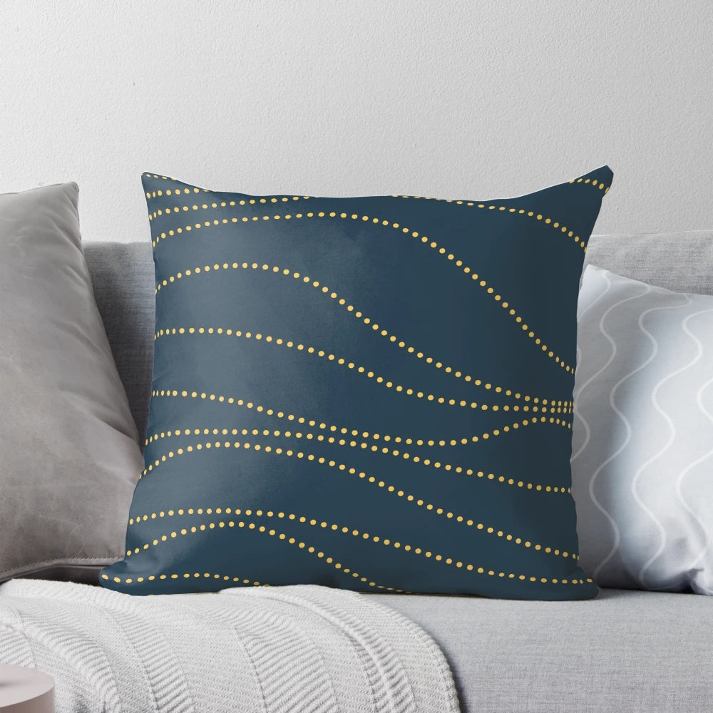 A modern, minimalist pillow in a sophisticated navy blue and mustard yellow pattern.