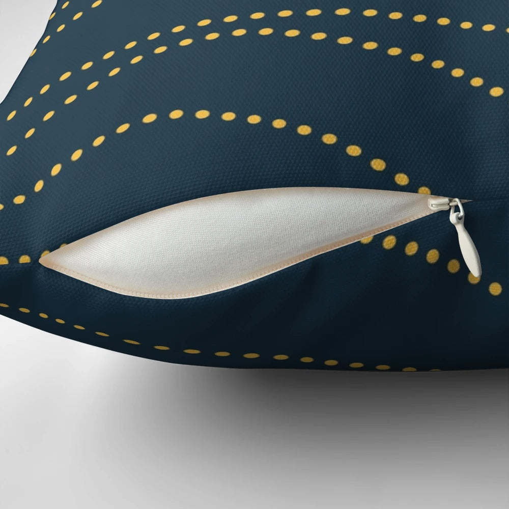 A modern, minimalist pillow in a sophisticated navy blue and mustard yellow pattern.