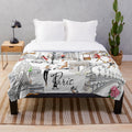 Paris-inspired plush blanket with Eiffel Tower and floral design