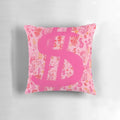A vibrant pink throw pillow featuring a bold dollar sign graphic inspired by pop art and graffiti.