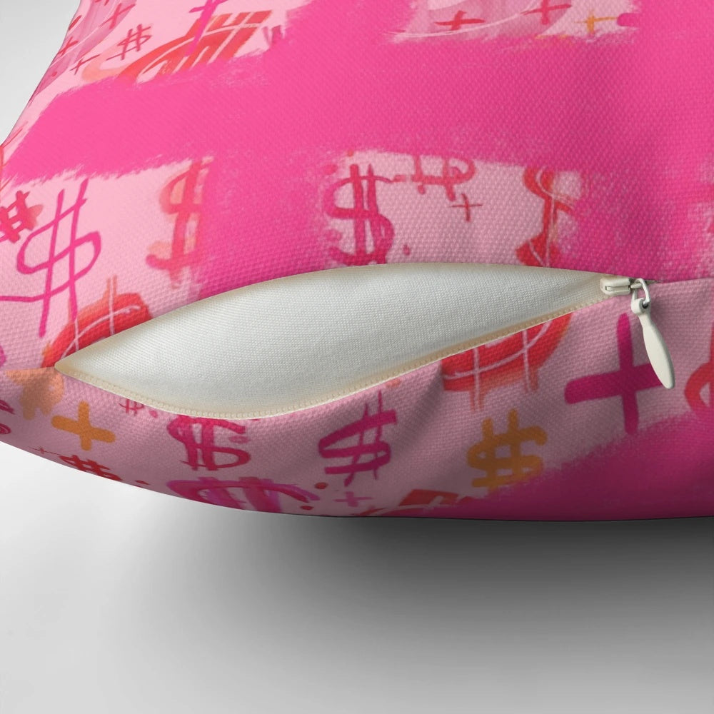 A vibrant pink throw pillow featuring a bold dollar sign graphic inspired by pop art and graffiti.