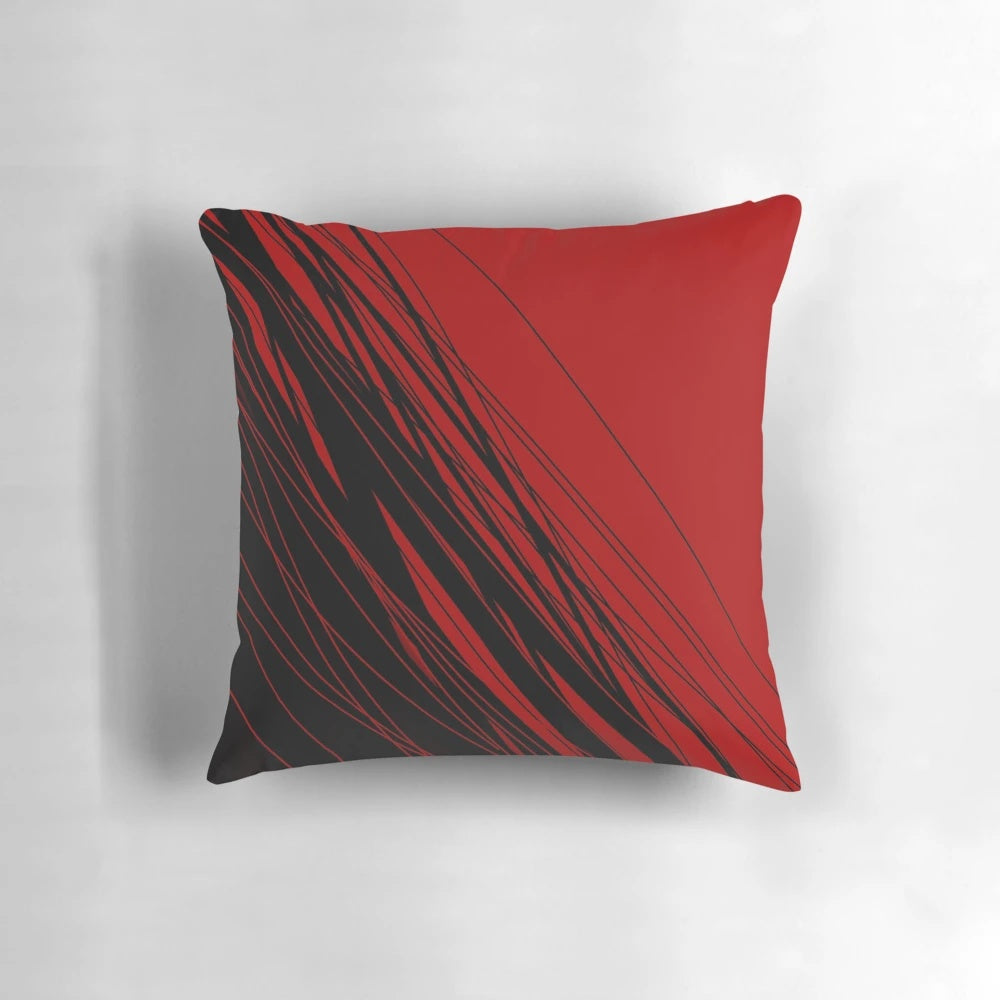 A stylish red and black patterned throw pillow, perfect for adding a touch of modern flair to any room.