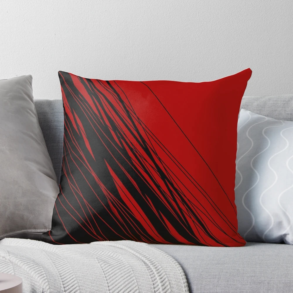 A stylish red and black patterned throw pillow, perfect for adding a touch of modern flair to any room.