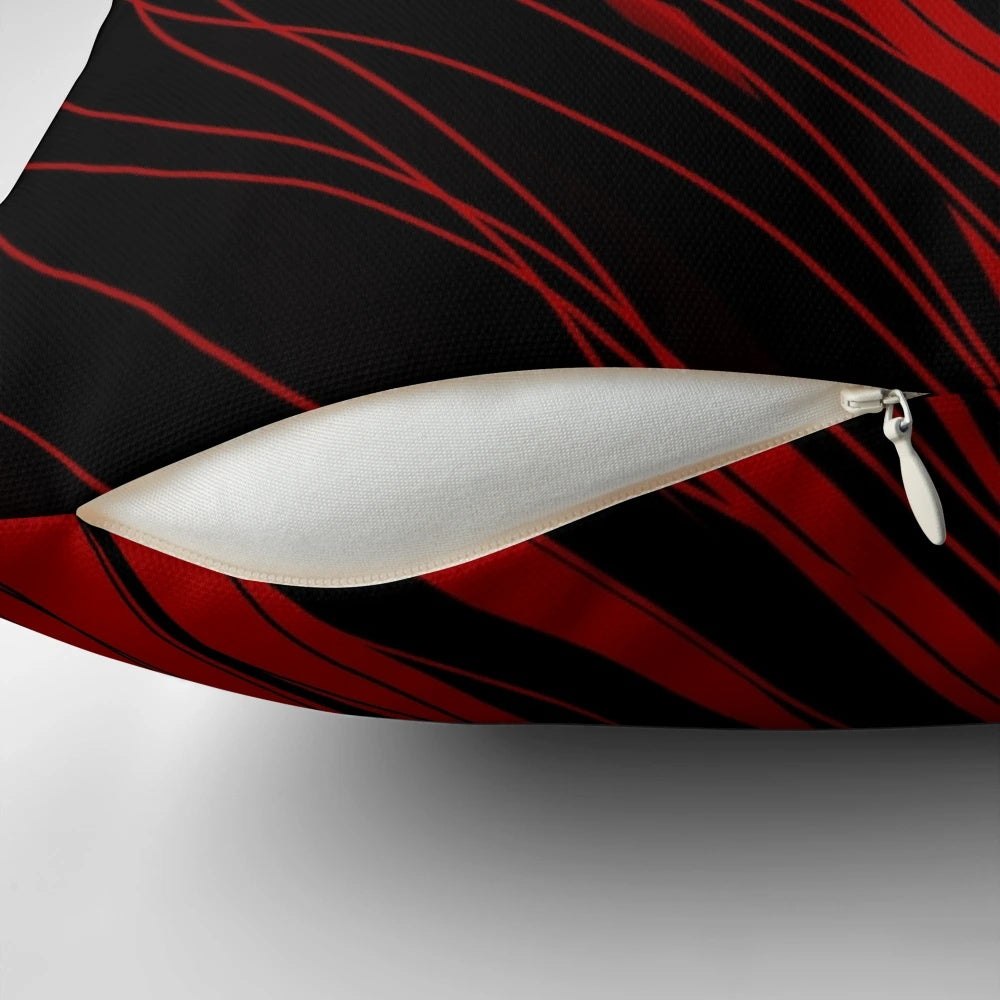 A stylish red and black patterned throw pillow, perfect for adding a touch of modern flair to any room.