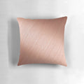 Rose gold reflective pillow with a modern, abstract design