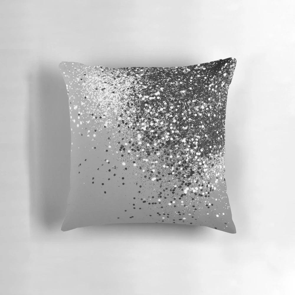 A silver gray pillow with a glitter design, perfect for adding a touch of glamour to any space.