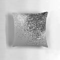 A silver gray pillow with a glitter design, perfect for adding a touch of glamour to any space.