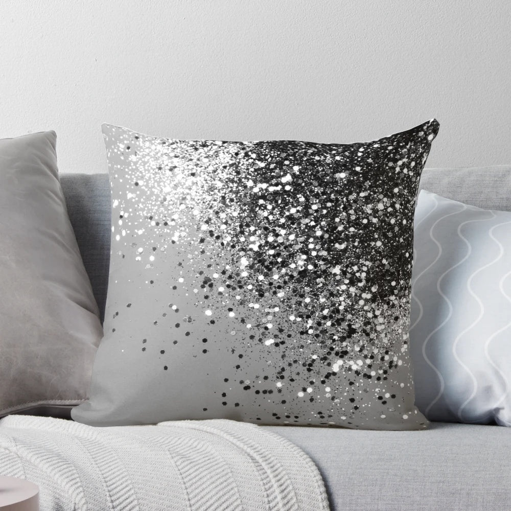 A silver gray pillow with a glitter design, perfect for adding a touch of glamour to any space.