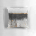 Soot and gold decorative pillow with a minimalist, abstract design