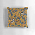 Decorative throw pillow featuring a pattern of chickadee birds perched on blueberry branches.