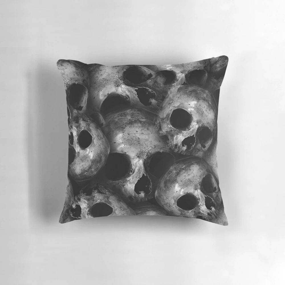 Dark skulls pattern on a decorative pillow, a creepy and gothic home accent.
