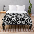Ghostface plush blanket with spooky horror design
